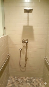 hower and grab bars add to an accessible shower in dawsonville, GA by Contractormen.