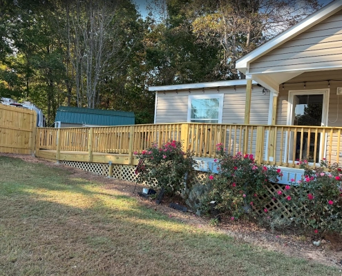 Custom wooden wheelchair ramp designed to match home architecture. ContractorMen, Dansville, GA
